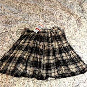 NWT Black and cream plaid mini pleated skirt.  XS.